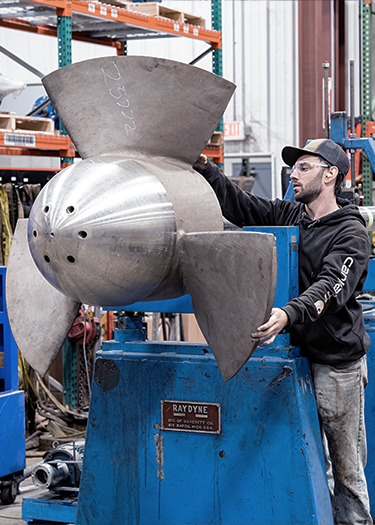 Large vertical turbine impeller being balanced on a heavy duty 10,000 pound capacity balancing machine