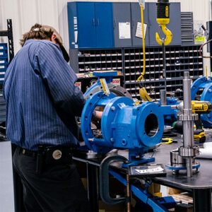 SKF certified technicians working on a pump repair in a clean room at Southeast Pump Specialist, a leader in industrial pump repair services.